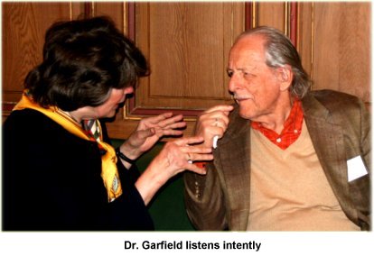 Dr Garfield listens intently